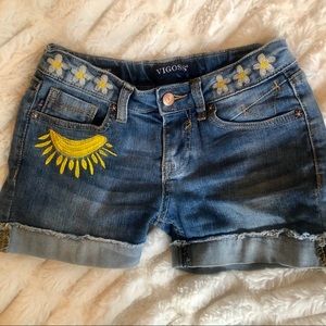 Girls jean shorts with an embroidered sun